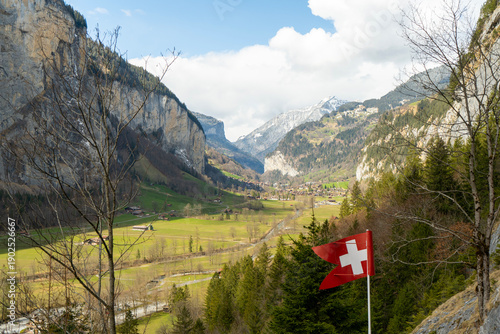 Wallpaper Mural Majestic Swiss Alpine Valley with National Flag Torontodigital.ca