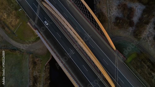speed ramp German autobahn bridge over river. Unique aerial view drone