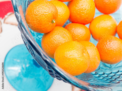 Canvas Print Tangerines in a blue vase.