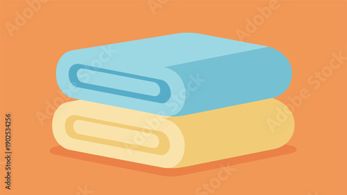 Stack of two folded fluffy towels in light blue and yellow colors isolated on a warm orange background for spa or home themes.