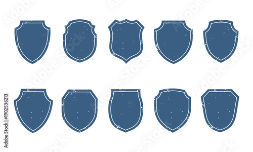 Blue security shield badge set with subtle grunge texture for insurance protection icons and classic heraldic emblem design elements