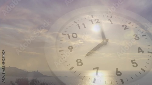 Analog clock face rotating over coast dawn, low sun causing hands rotating and showing time passing