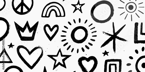Whimsical black and white doodle pattern with celestial and playful shapes