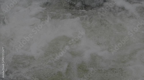 Water rushing over rocks in river slow motion in Cumbria mountains UK 4K 120fps slow motion