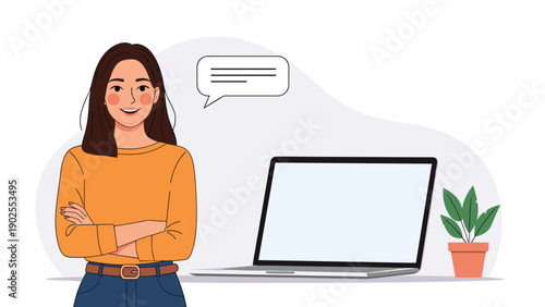 Smiling young woman standing with arms crossed next to a laptop computer and a blank speech bubble for messaging.