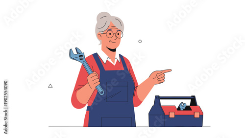 Experienced senior woman mechanic wearing blue overalls holding a large wrench and pointing toward an open toolbox on a white background.