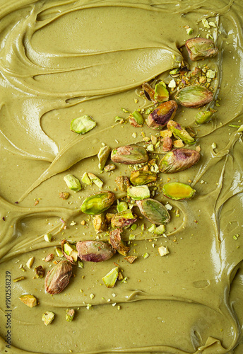 the texture of pistachio paste, with pistachios and crumbs, full frame, close-up,
