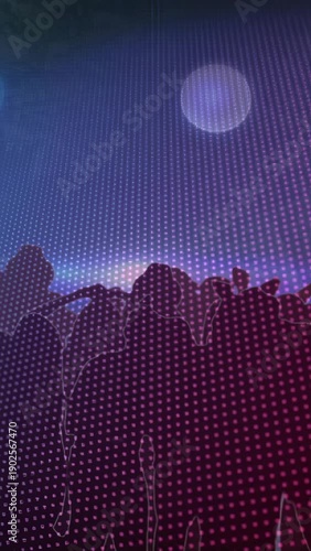 Vertical video: LED dots pulsing, crowd swaying, arms rising and lowering, boosting concert energy