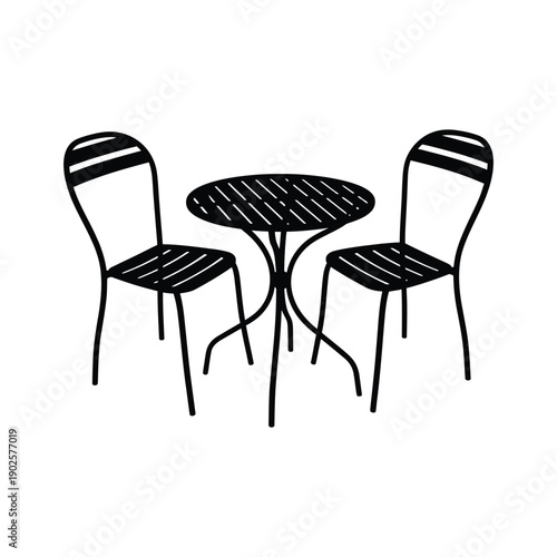 Black chairs and table with round top