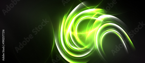 Bright green energy swirls against dark background. Abstract light patterns create dynamic visual effect. Smooth curves suggest motion, power.