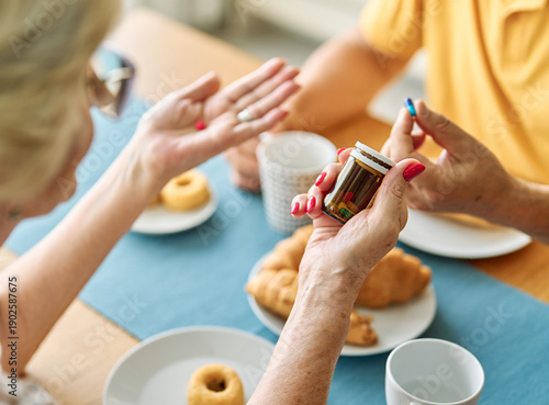 Wallpaper Mural Portrait of a senior couple man and woman  holding drug or prescription before taking pills during eating food lunch at home Torontodigital.ca