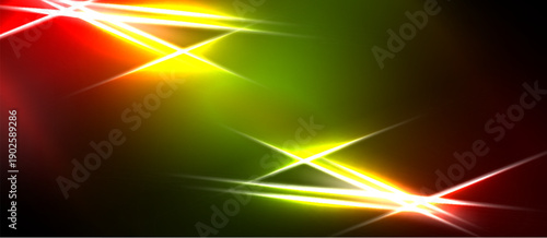 Vibrant abstract background. Red, green, yellow streaks intersect, creating dynamic light effects. Dark borders frame bright colors.