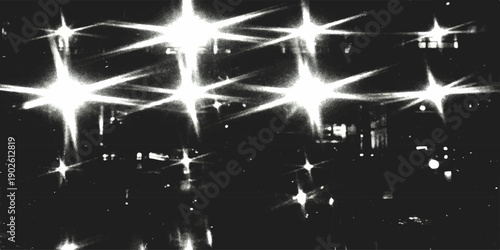 Abstract sparkling starburst lights and bokeh reflections on a dark night cityscape background vector illustration