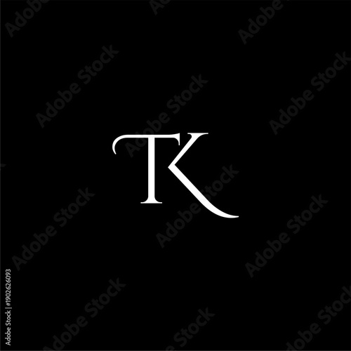 White TK Monogram on Black Background.