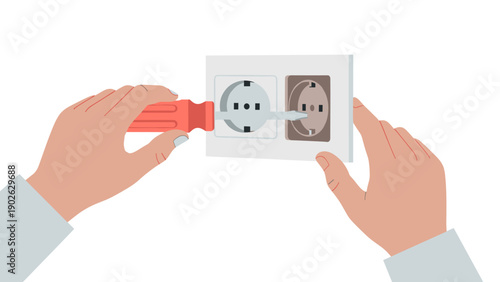 Person fixing electrical outlet with screwdriver