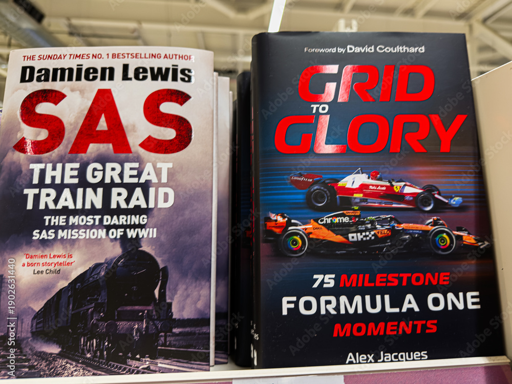 Fototapeta premium Two history and racing books on a shelf feature SAS mission and Formula One moments