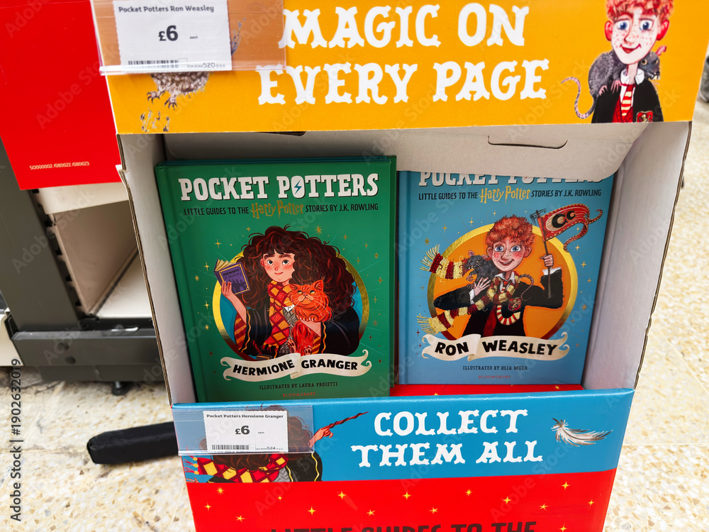Naklejka premium Bright display of pocket potters books featuring Hermione Granger and Ron Weasley with promotional sign