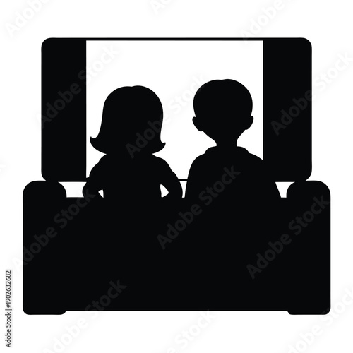 Silhouette of couple watching a movie on the couch in living room