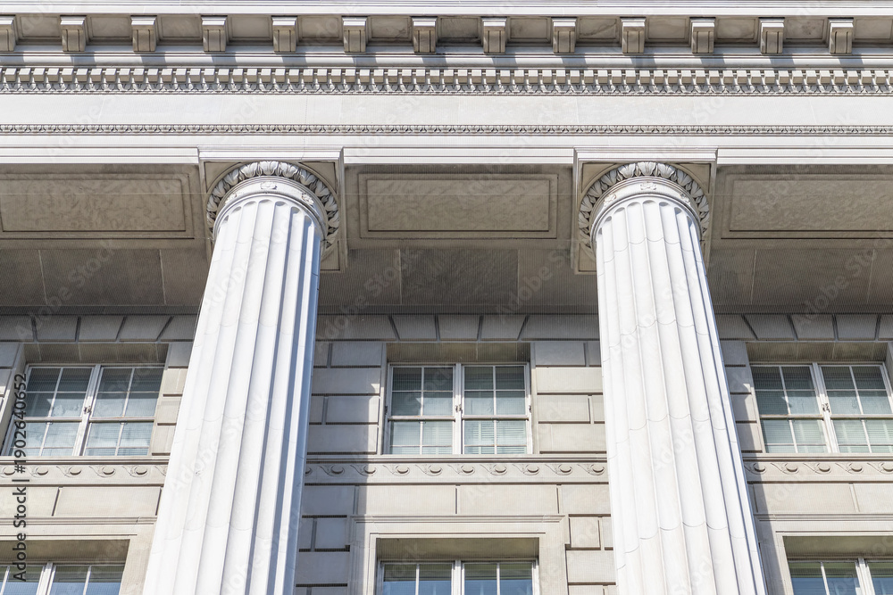Fototapeta premium Monumental Neoclassical Architecture With Stone Columns Reliefs And Cloudless Blue Sky