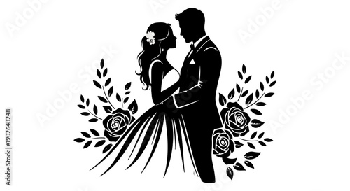 A silhouette of a bride and groom embracing framed by floral decorations

