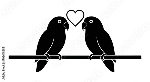 Two black lovebirds perched on a branch with a heart floating between them

