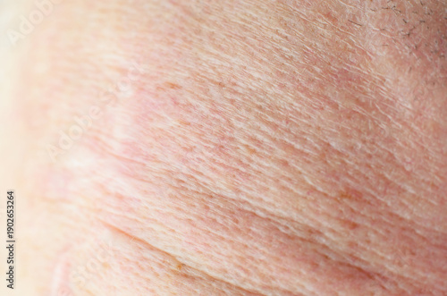 Canvas Print Extreme close-up of aged human skin texture with fine wrinkles and subtle discol