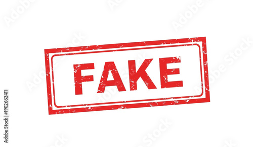 A red rubber stamp with the word fake on a for marking documents as counterfeit or unoriginal