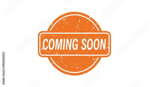 A bright orange coming soon stamp on a with a distressed texture