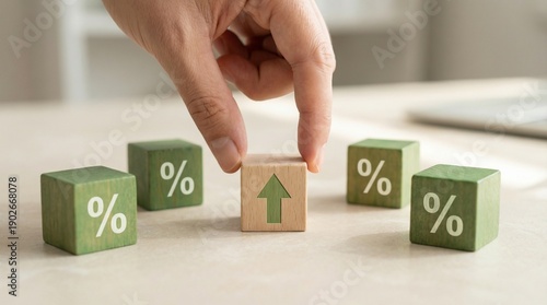 Hand setting growth arrow cube among percentage symbols on smooth table representing financial statistics forecasting and revenue improvement