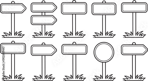 Various blank directional signs on grassy areas blank signs