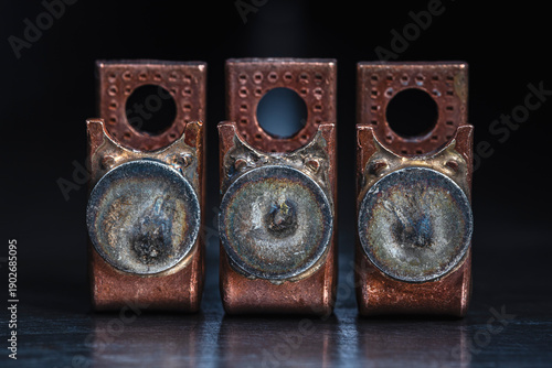 Photography Close up of copper electrical contactor components with patinated silver contacts