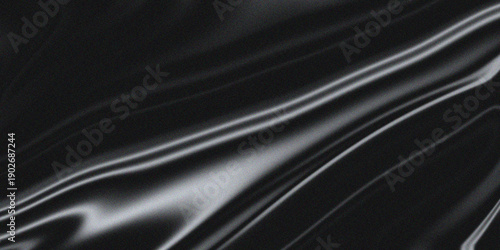 Valokuva A close-up view of a shiny black fabric with a smooth and glossy texture