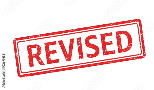 Red rubber stamp with the word revised on for editing and approval purposes in documents