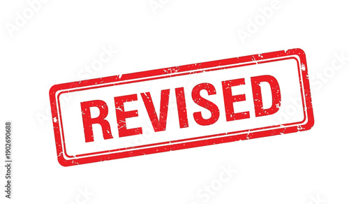 Red rubber stamp with the word revised on for editing purposes