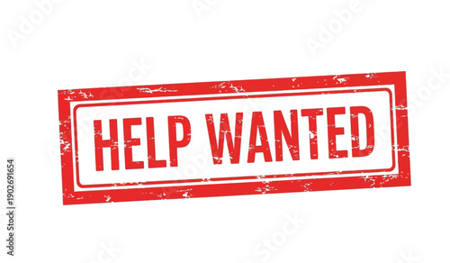 A red help wanted sign on a with a distressed texture and a rectangular shape