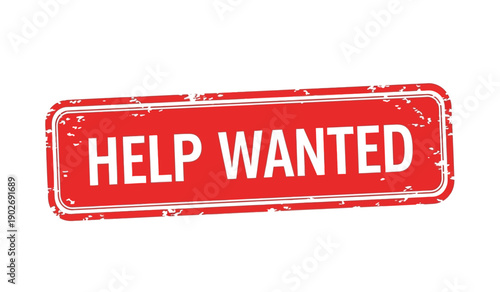 A red help wanted sign on a with a distressed texture and white text