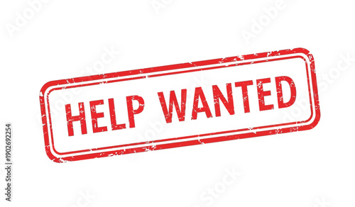 A red help wanted sign on a with a distressed texture