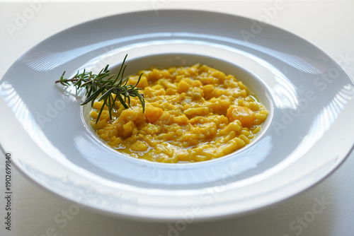 Creamy pumpkin risotto on white background 