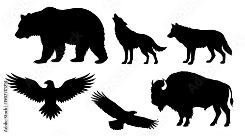 Collection of black animal silhouettes featuring a large bear howling wolf standing wolf flying eagles and a wild american bison