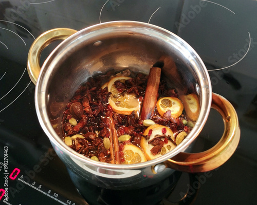 Εκτύπωση καμβά Pot filled with aromatic spices and citrus slices simmering on a stovetop, showc