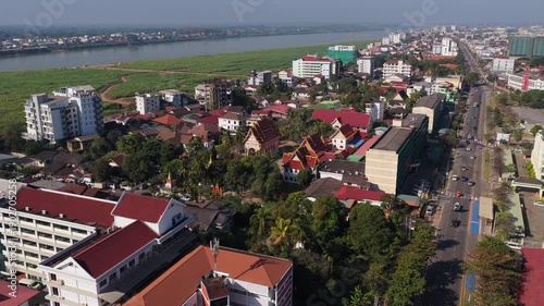 Wallpaper Mural Urban landscape of Vientiane, Laos with its buddhist temples, traditional architecture, modern buildings and avenue with traffic Torontodigital.ca