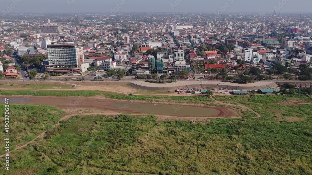 custom made wallpaper toronto digitalAerial survey of Vientiane cityscape showing Mekong riverside, chaotic streets with car traffic and urban development in Laos