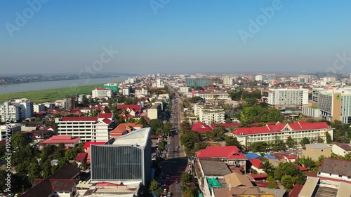 Wallpaper Mural High angle of Wat Si Muang buddhist temple complex in Vientiane Laos with traditional architecture and lush trees Torontodigital.ca