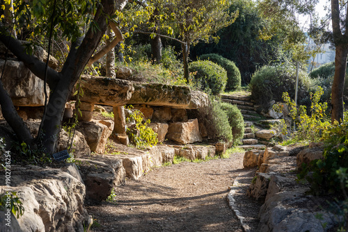 Jerusalem, Israel, Botanical Garden. view of reconstructed ancient terraced gardens with stepped limestone walls and cave openings 
