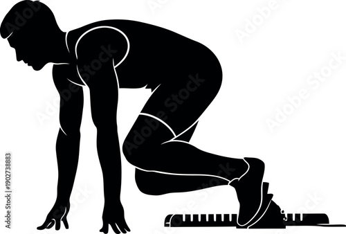 Silhouette of a male sprinter in starting blocks ready for race