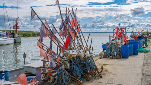 Fishing gear and flags on harbor pier