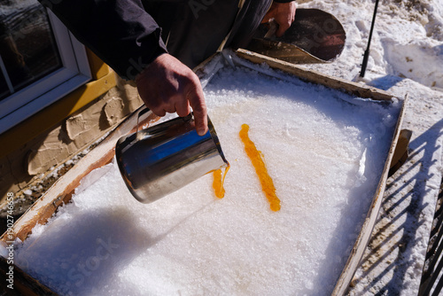 Photos Pouring hot maple syrup on snow to make maple taffy