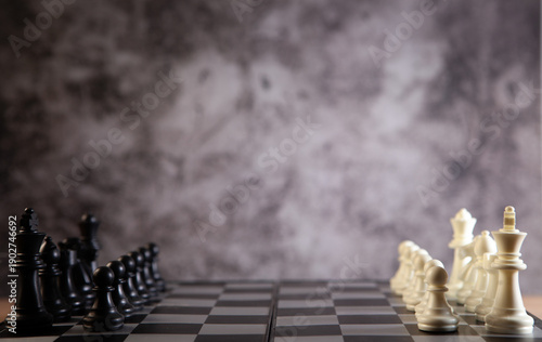 chess board with chess pieces and chess board on dark background. business strategy and strategy concept