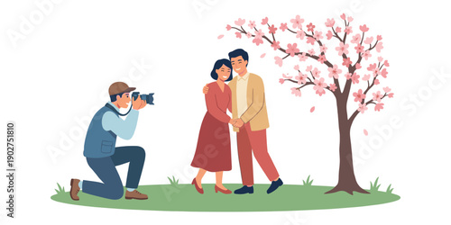 Photographer taking photo of happy couple in love under blooming cherry tree