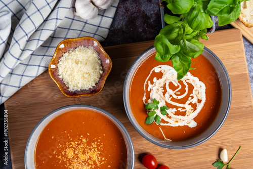 Creamy tomato soup with crusty baguette slices. 